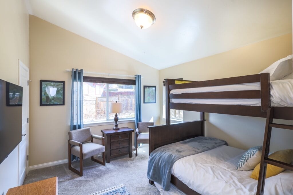 A bedroom with bunk beds and a TV located in Atascadero, on the Central Coast of California.