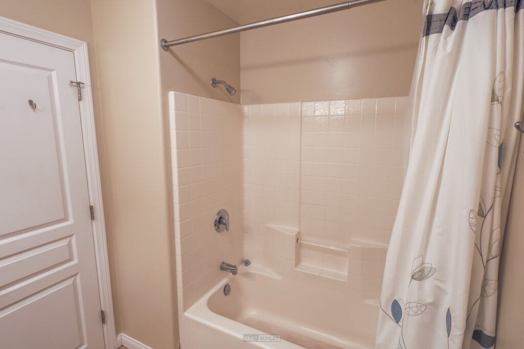 A vacation rental with a tub and shower curtain ideally located in Pismo Beach or Morro Bay.