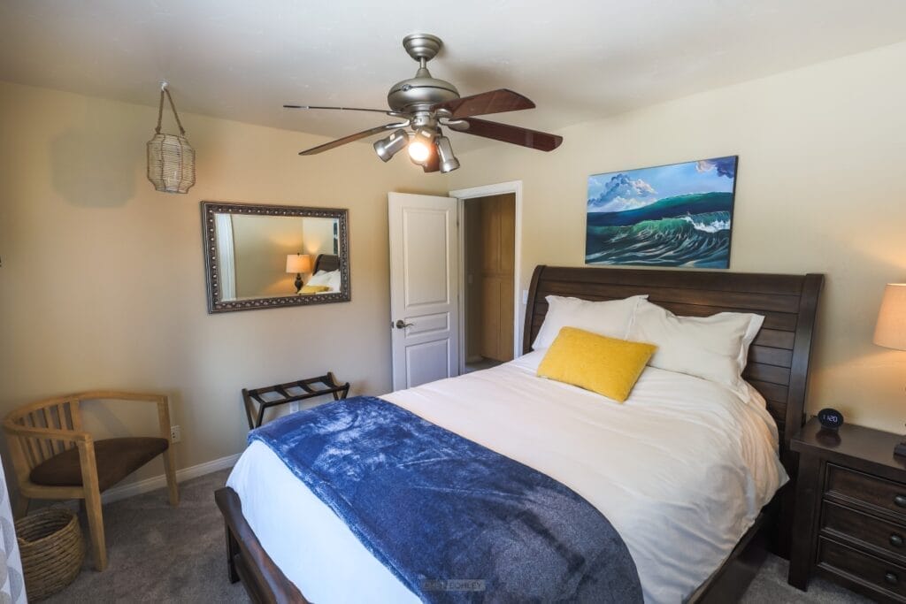 A bedroom with a bed and a ceiling fan in Paso Robles.