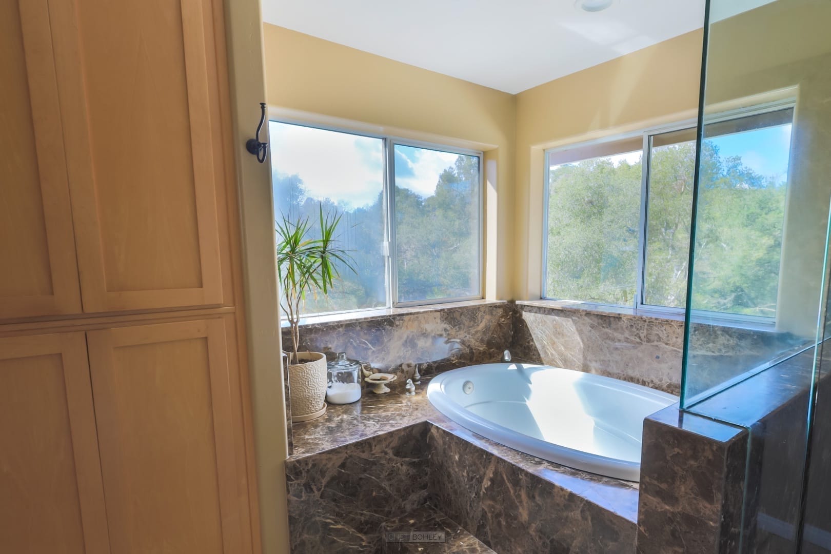 A vacation rental bathroom in Paso Robles with a jacuzzi tub and a window.
