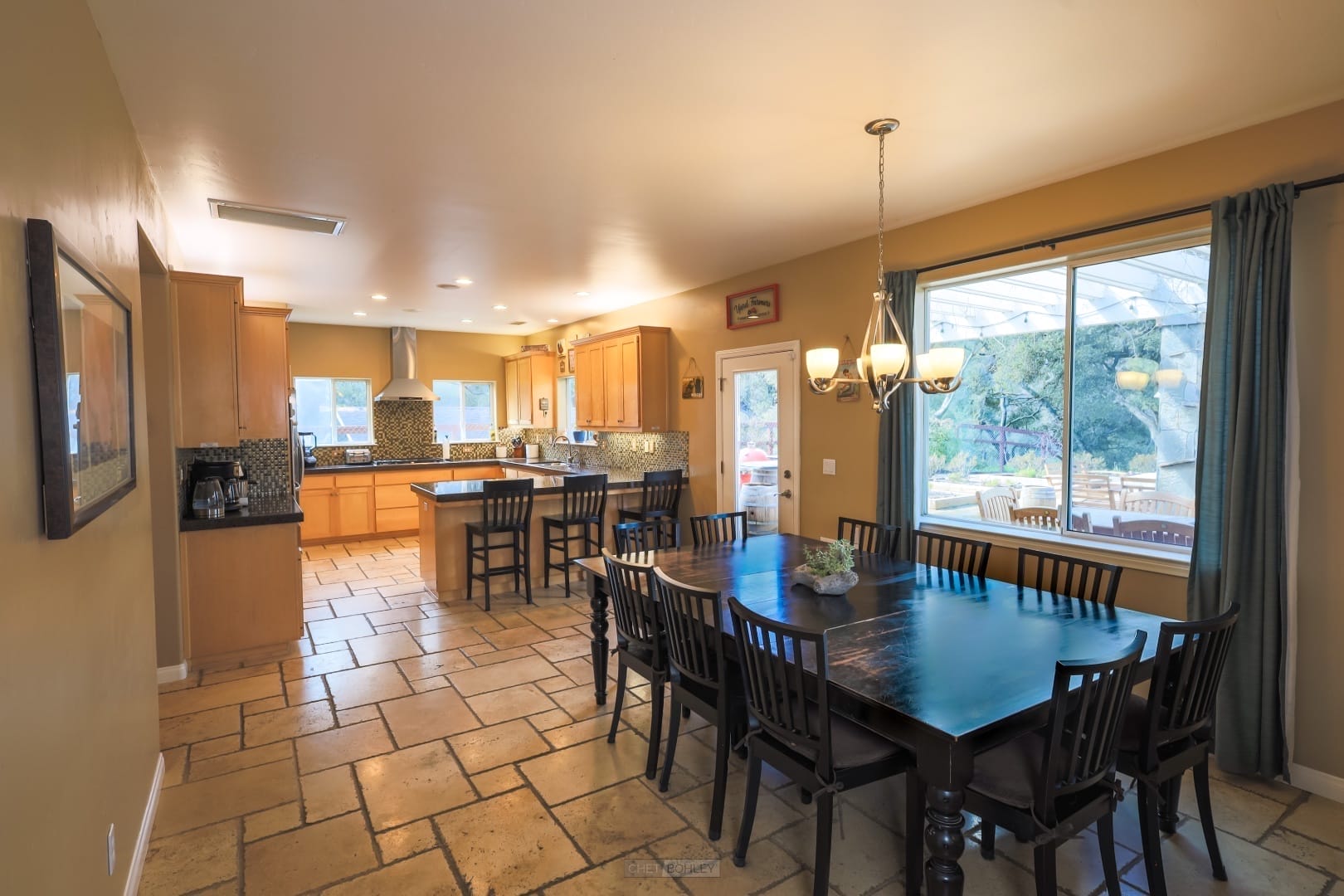 A vacation rental with tile floors and a dining table in Morro Bay, a short distance from Pismo Beach.