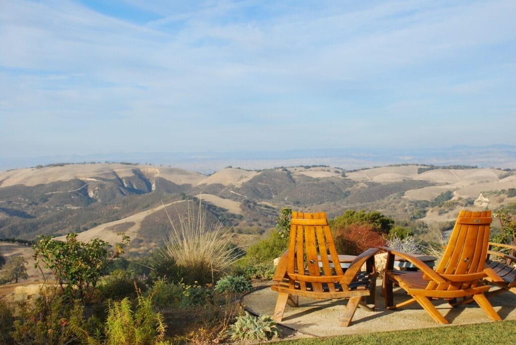 Two wooden chairs on a grassy area in Atascadero, Central Coast.