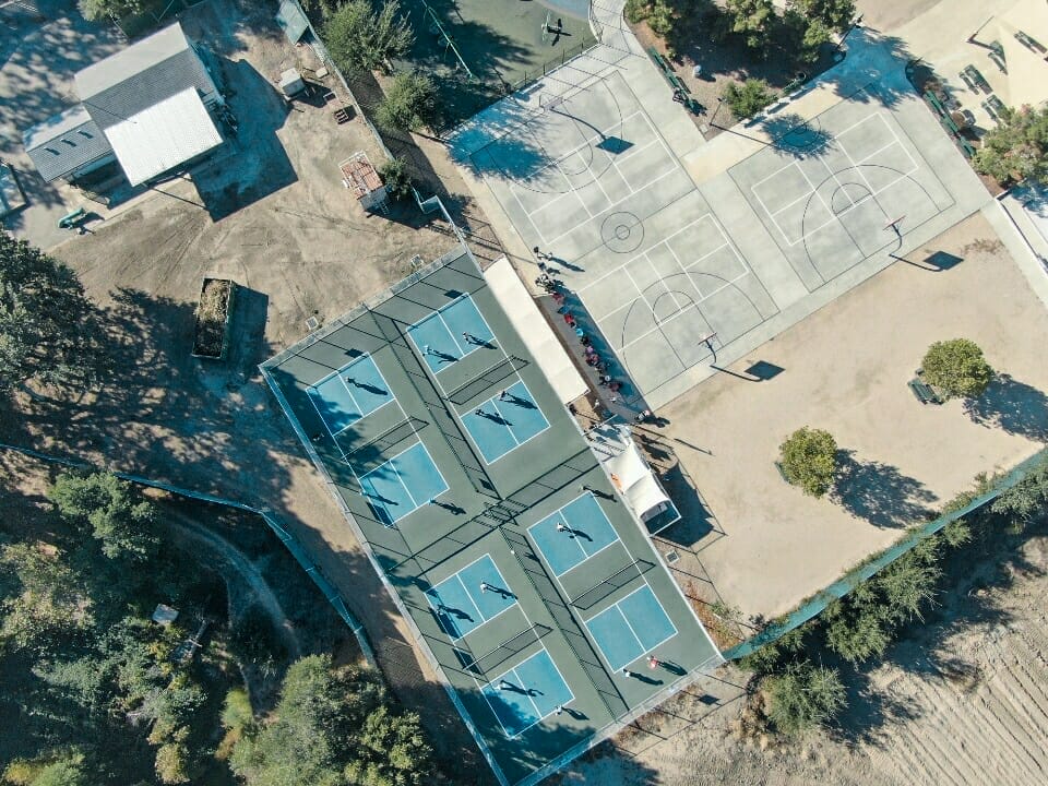 A vacation rental with an aerial view of a tennis court on the Central Coast near Pismo Beach.